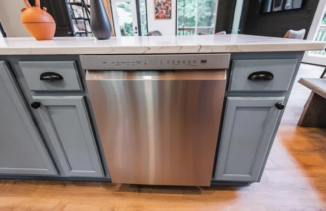 a white toilet sitting next to a bathroom sink