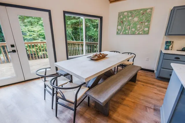 a kitchen with granite countertop stainless steel appliances a refrigerator stove top oven and sink