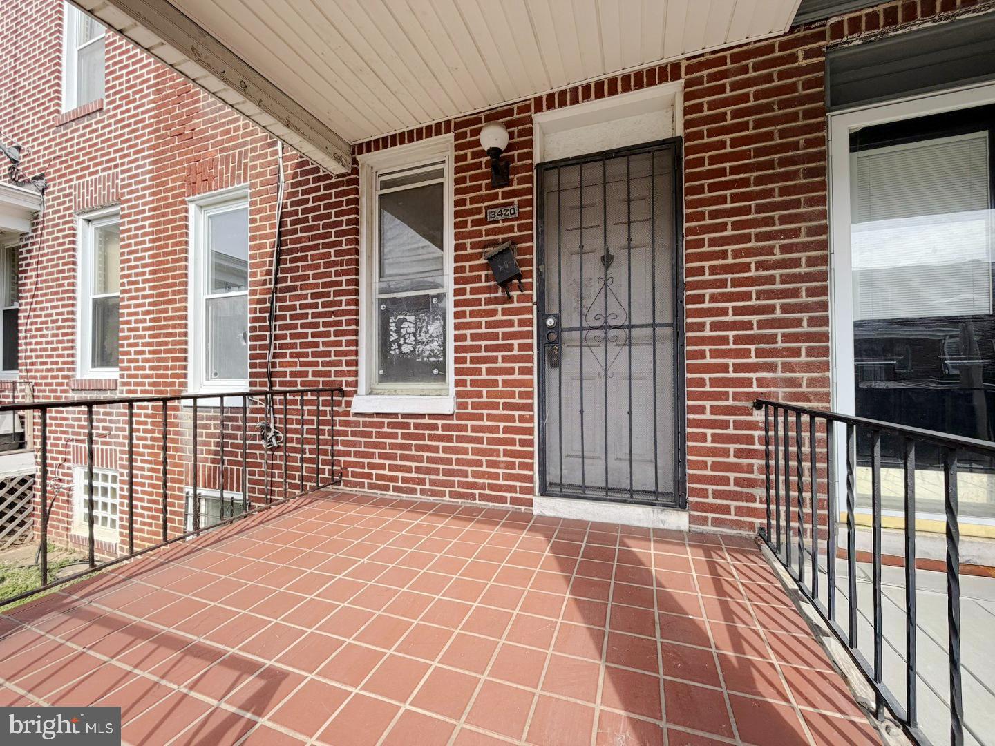 3420 Lyndale Avenue Baltimore, MD 21213 - Photo 2 of 24 a view of a balcony with a door