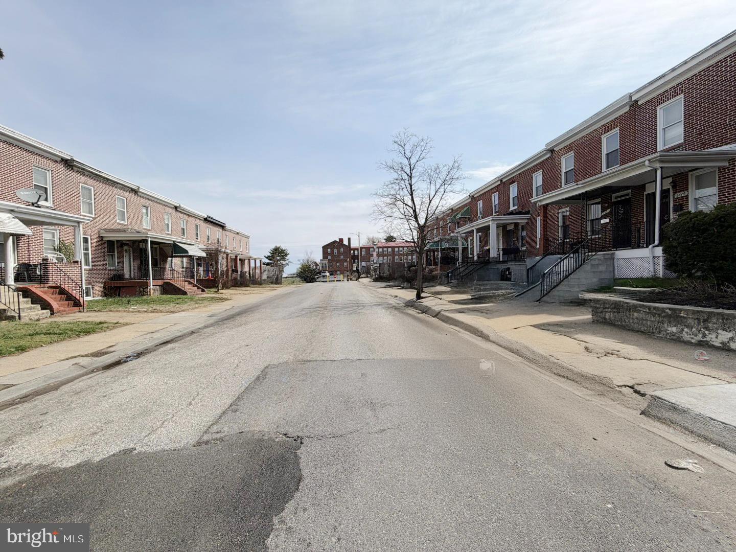 3420 Lyndale Avenue Baltimore, MD 21213 - Photo 23 of 24 a view of a street with cars