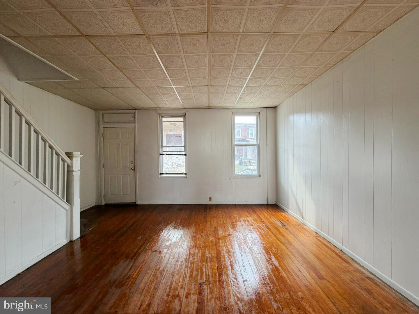 3420 Lyndale Avenue Baltimore, MD 21213 - Photo 5 of 24 wooden floor in an empty room with a window