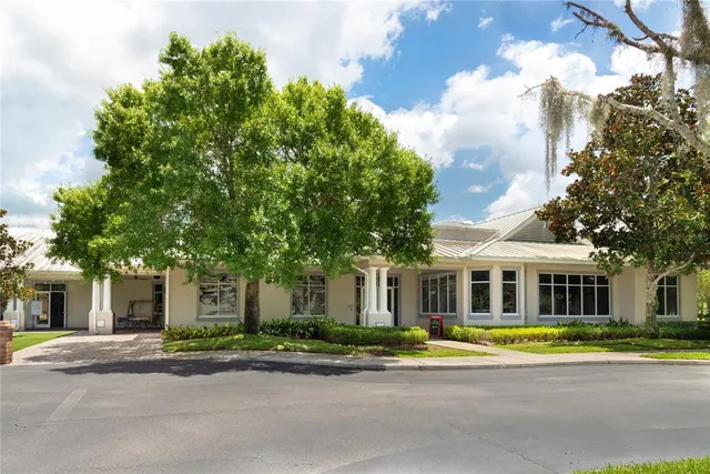 front view of a brick house next to a yard