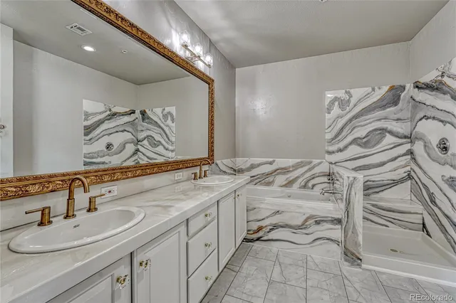 a bathroom with a double vanity sink and a mirror
