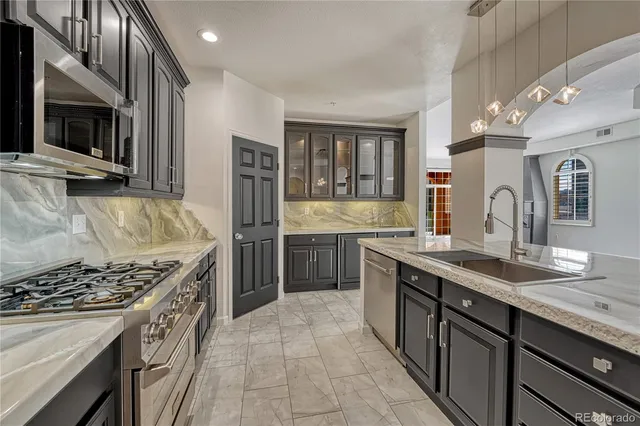 a kitchen with a sink and cabinets