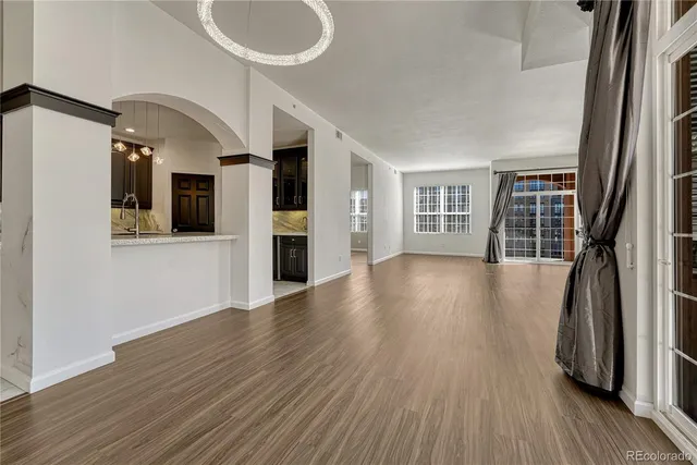 a view of an entryway with wooden floor