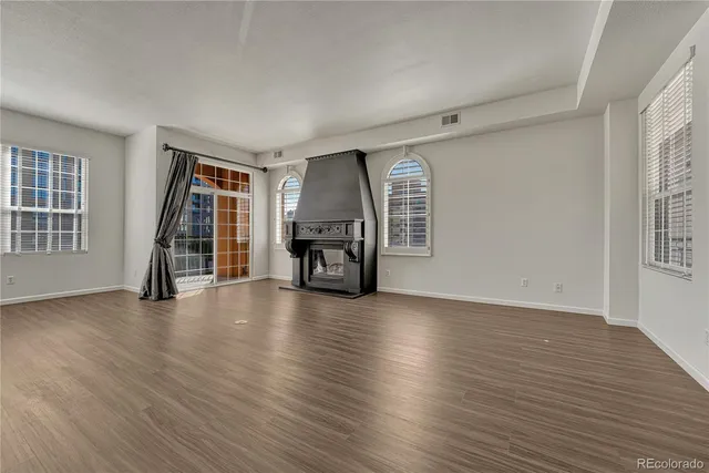 a bathroom with a bathtub shower sink mirror vanity and toilet
