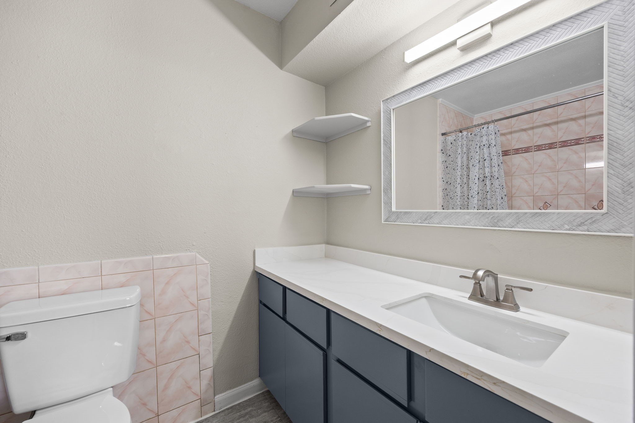 9616 Long Point Road, Unit 54 Houston, TX 77055 - Photo 15 of 18 a bathroom with a sink and a toilet