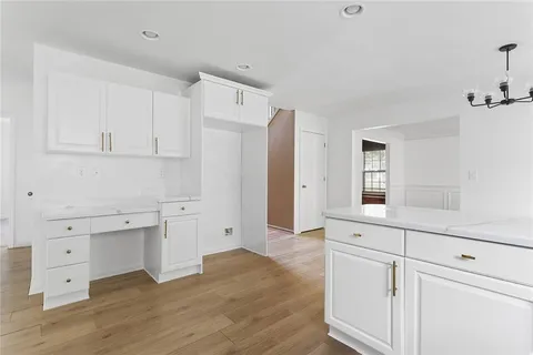 a view of cabinets and wooden floor