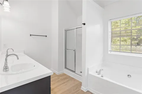 a bathroom with a bathtub and a sink