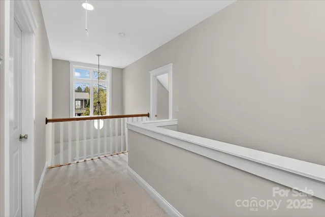 a bathroom with a bathtub and a window