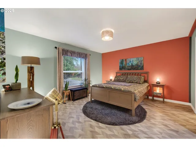 a bedroom with a large bed and a book shelf