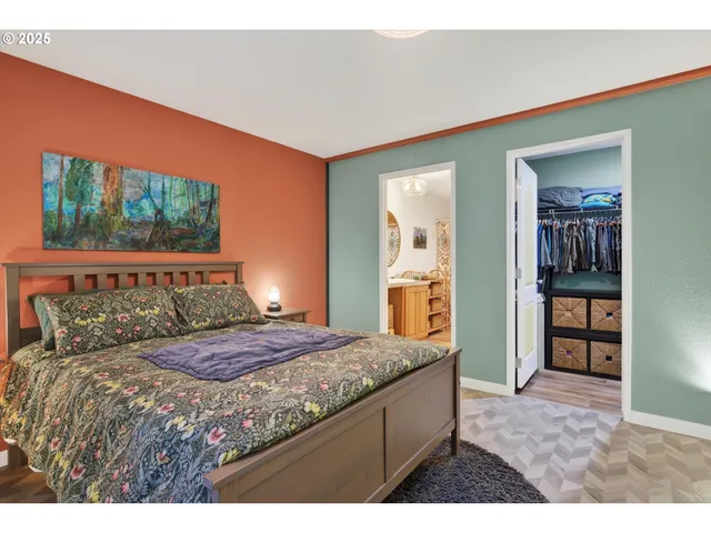 a bedroom with a bed and a dresser