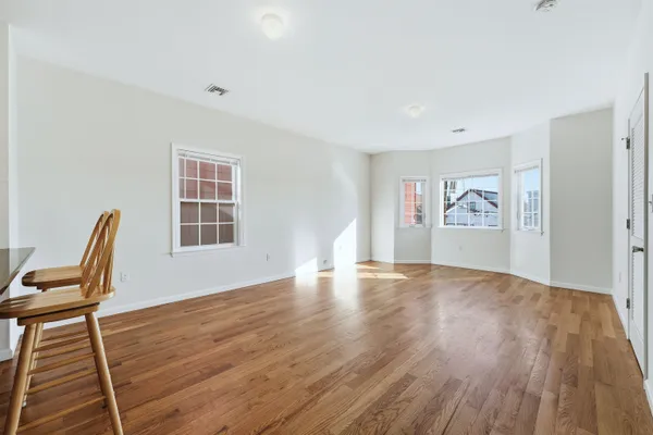 a view of livingroom with furniture wooden floor and window