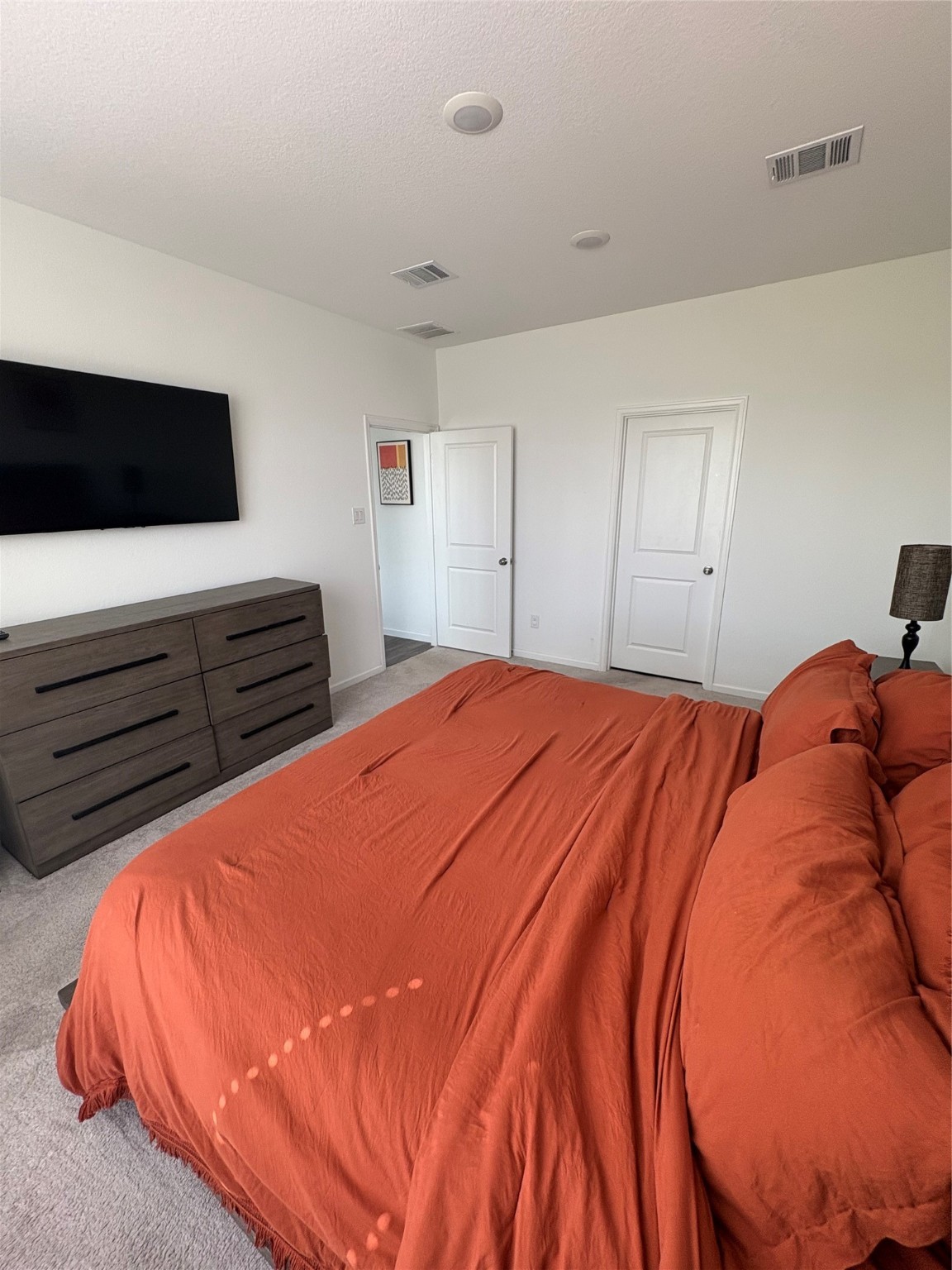 3703 Windy Brook Road Rosenberg, TX 77469 - Photo 12 of 22 a bedroom with a bed and flat screen tv