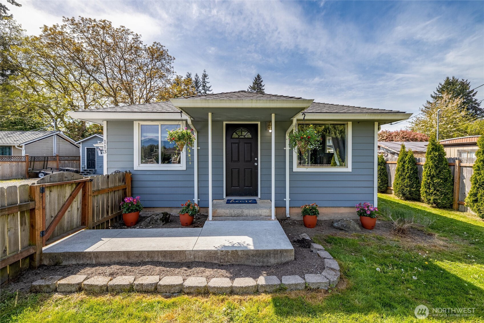 113 South Gardner Road Burlington, WA 98233 - Photo 1 of 40 a view of a house with backyard and porch