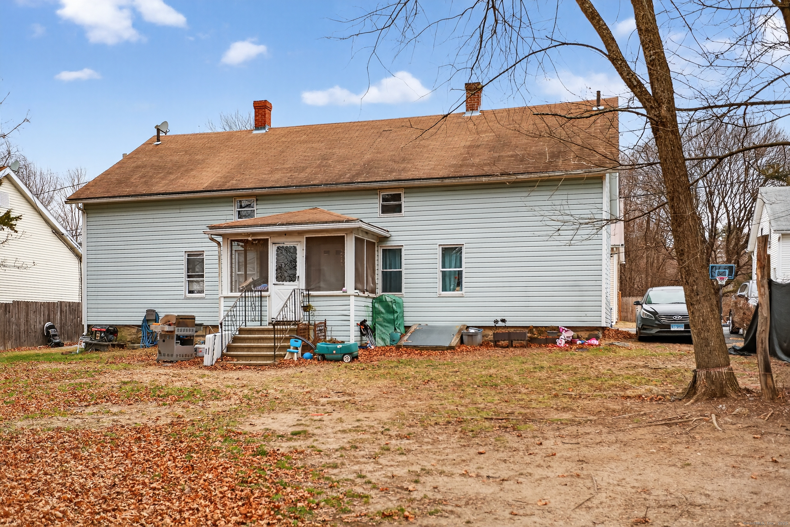 29 Church Street Killingly, CT 06241 - Photo 12 of 27 a backyard of a house with table and chairs