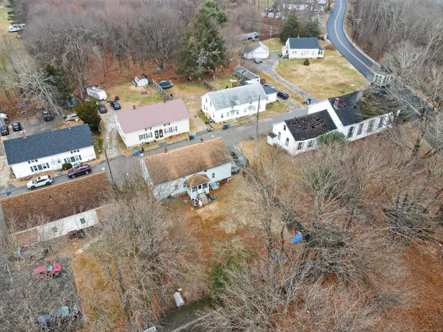 an aerial view of a house with swimming pool
