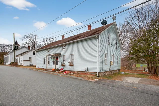a view of a house with a street