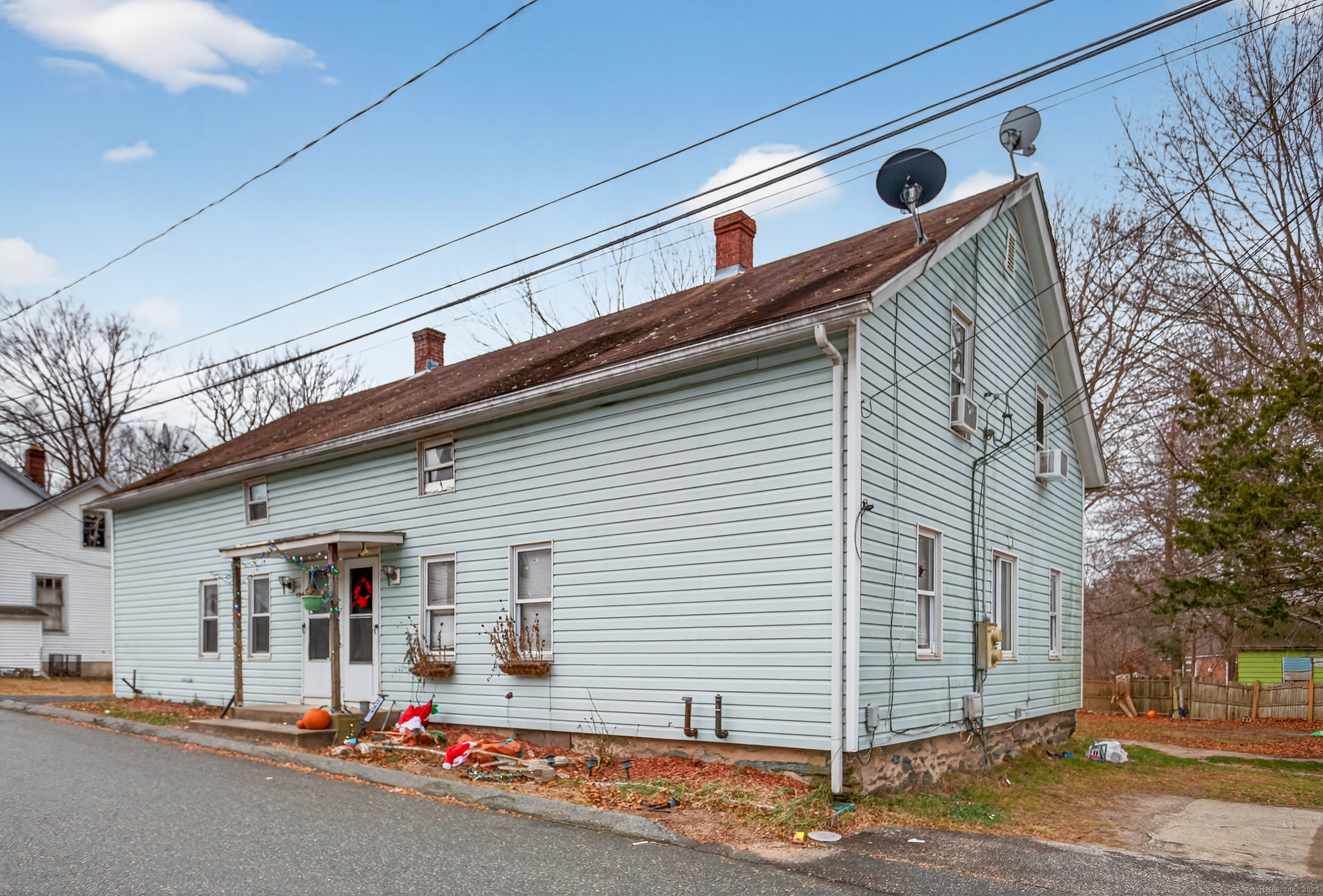 29 Church Street Killingly, CT 06241 - Photo 4 of 27 a front view of a house with garage