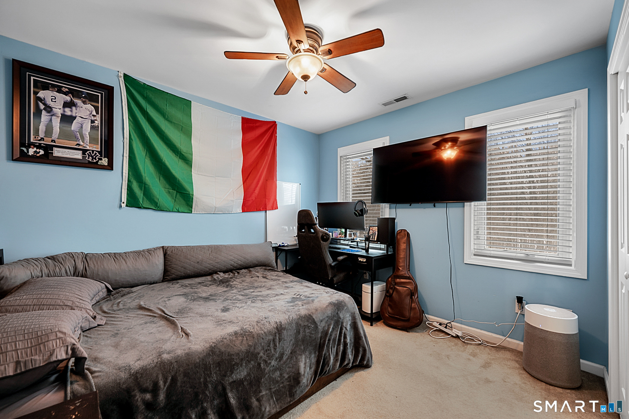 30 Silver Sands Road, Unit C9 East Haven, CT 06512 - Photo 19 of 36 a bedroom with a bed and a flat screen tv