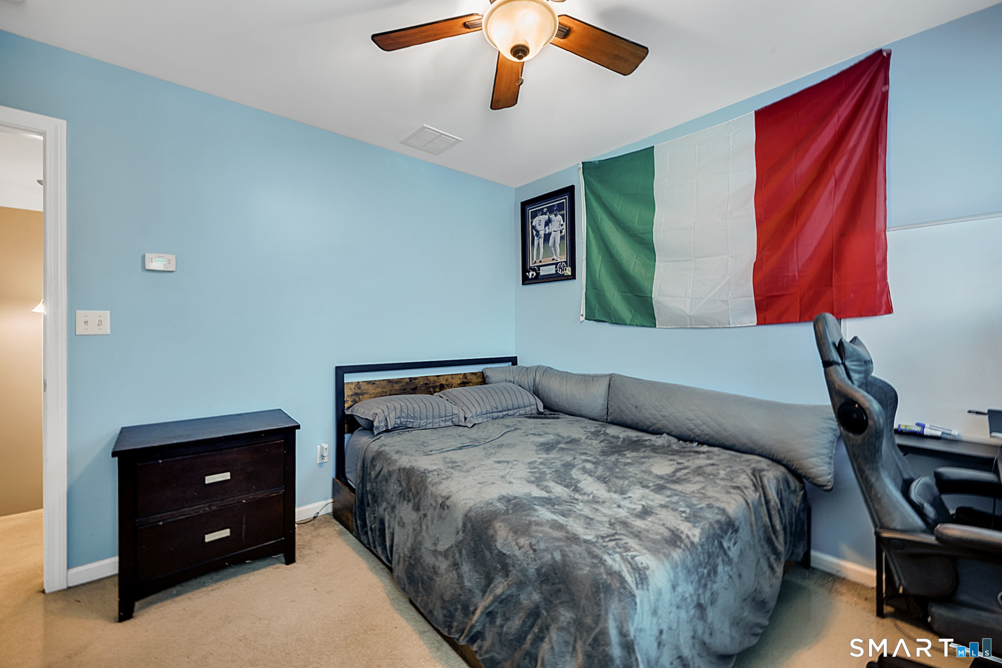 30 Silver Sands Road, Unit C9 East Haven, CT 06512 - Photo 20 of 36 a bedroom with a bed and a painting on the wall