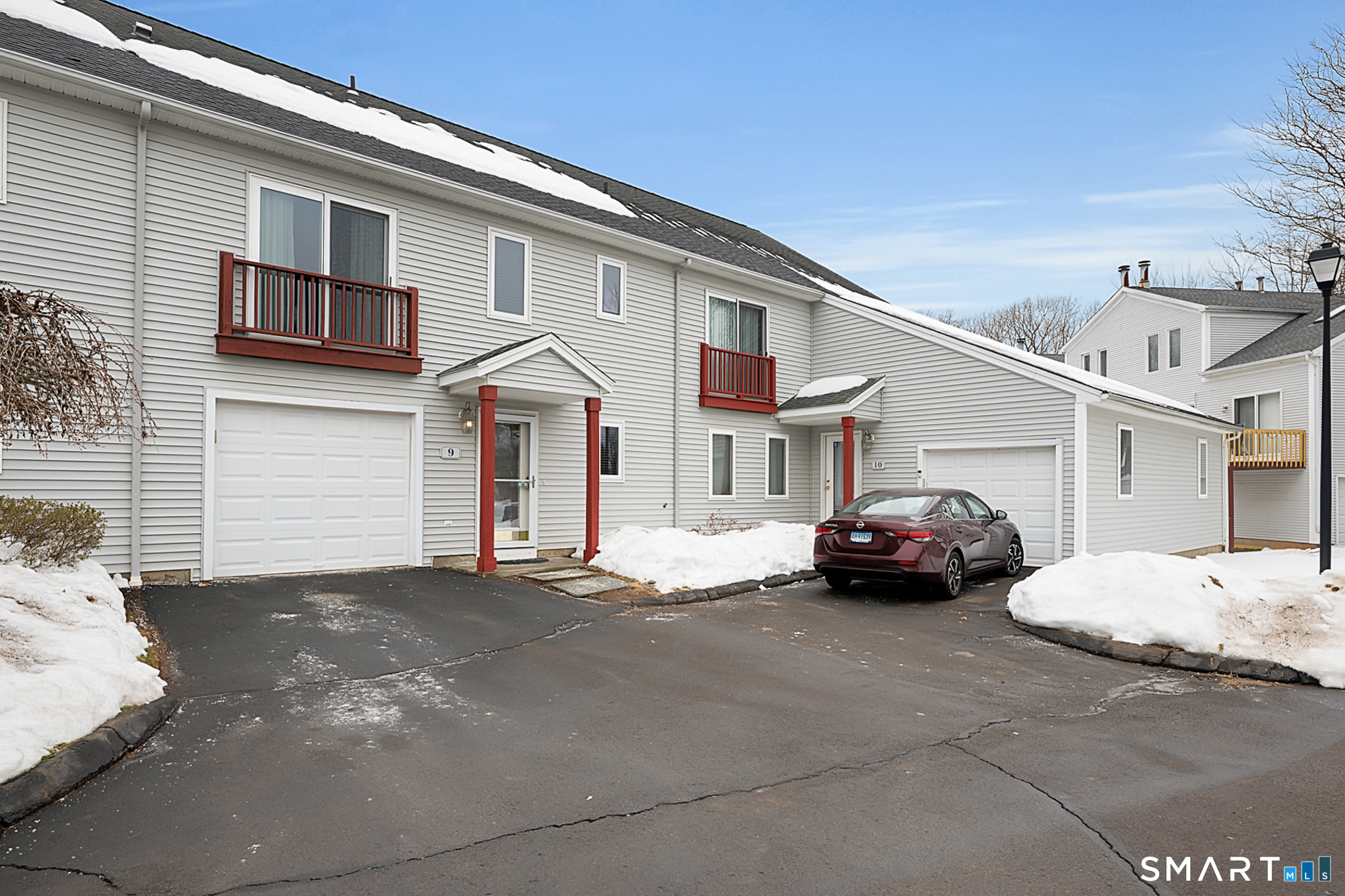 30 Silver Sands Road, Unit C9 East Haven, CT 06512 - Photo 30 of 36 a car parked in front of a white house