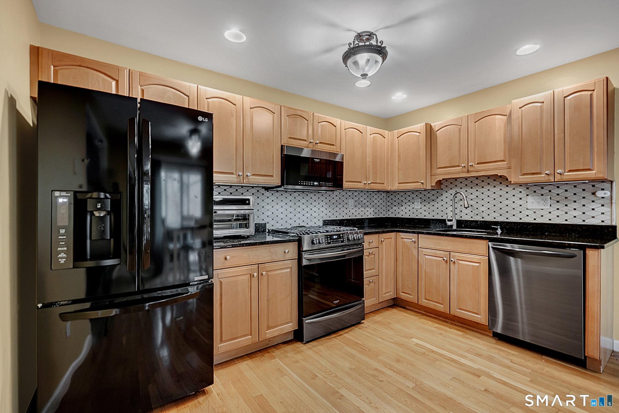 30 Silver Sands Road, Unit C9 East Haven, CT 06512 - Photo 3 of 36 a kitchen with a refrigerator stove and sink