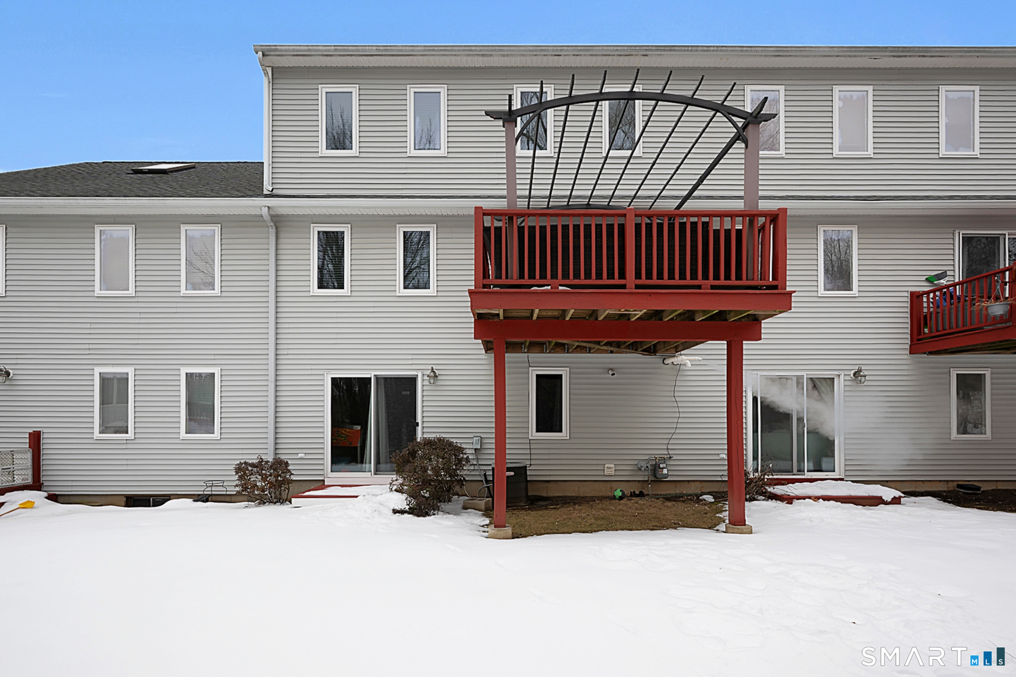 30 Silver Sands Road, Unit C9 East Haven, CT 06512 - Photo 33 of 36 a front view of a house with barbeque oven and glass windows