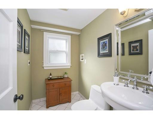 20 Manning Street Lexington, MA 02421 - Photo 11 of 21 a bathroom with a sink a mirror and a window