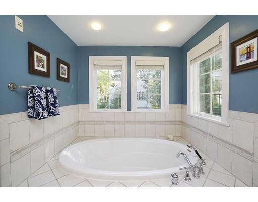 20 Manning Street Lexington, MA 02421 - Photo 14 of 21 a bath tub sitting in a bathroom next to a window