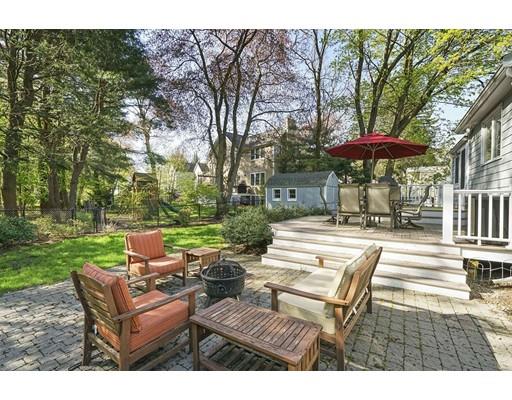 20 Manning Street Lexington, MA 02421 - Photo 21 of 21 a view of a patio with couches and table and chairs under an umbrella