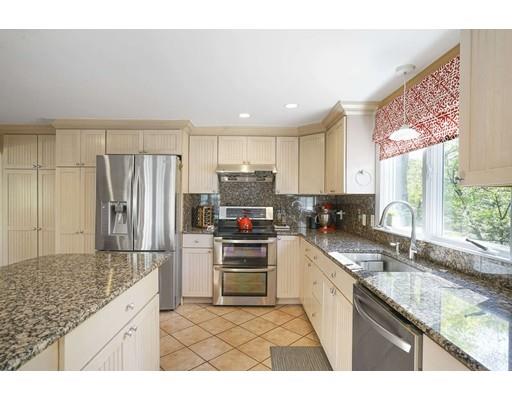 20 Manning Street Lexington, MA 02421 - Photo 10 of 21 a kitchen with refrigerator cabinets and a sink