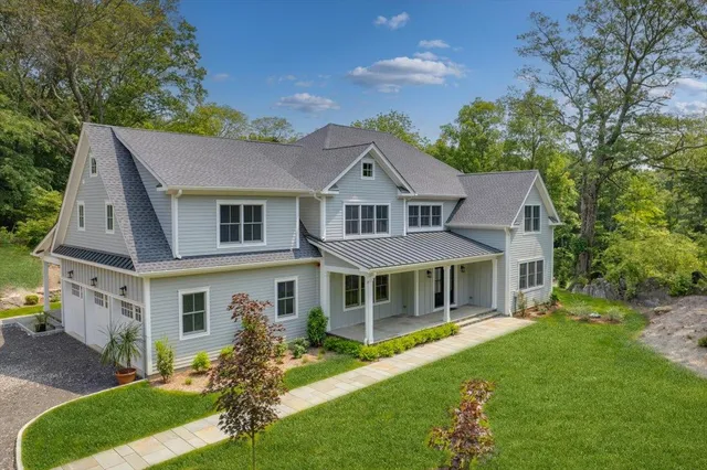 front view of a house with a yard