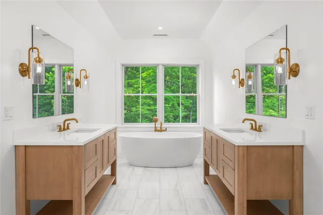 a bath tub sitting next to a window