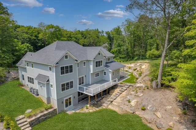 an aerial view of a house with a yard