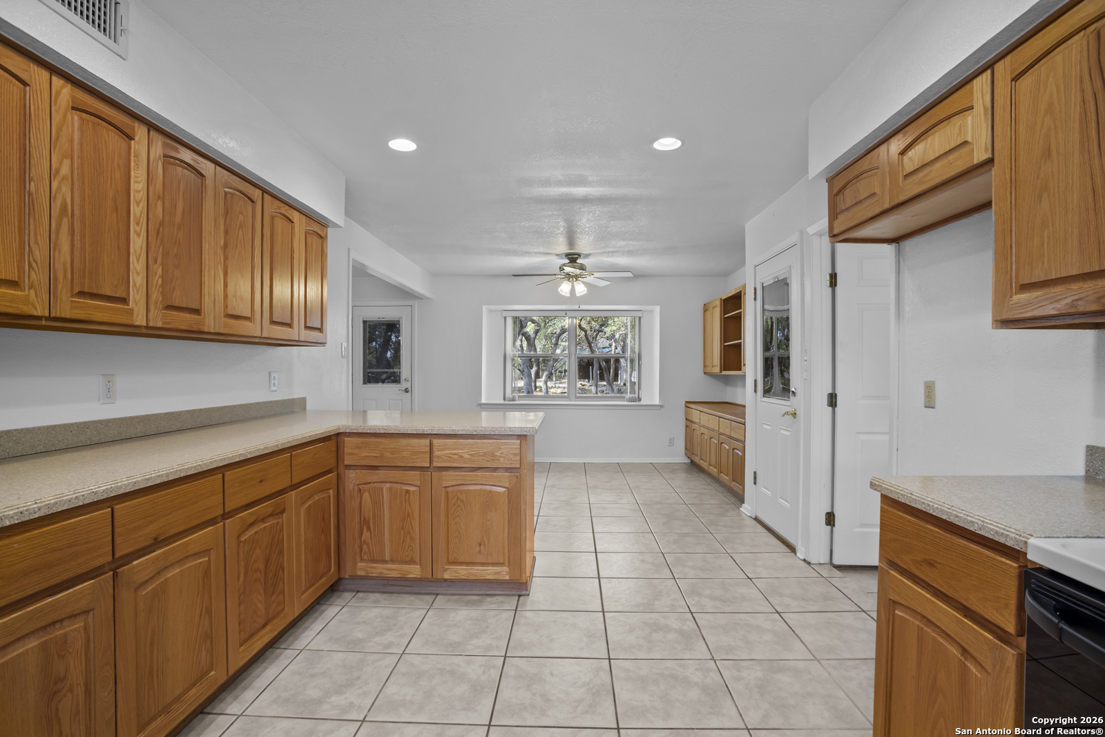33171 Blanco Road Bulverde, TX 78163 - Photo 15 of 59 a large kitchen with stainless steel appliances granite countertop a refrigerator and a sink