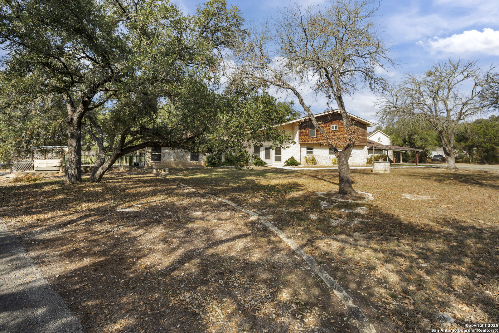 33171 Blanco Road Bulverde, TX 78163 - Photo 2 of 59 a view of road with large trees