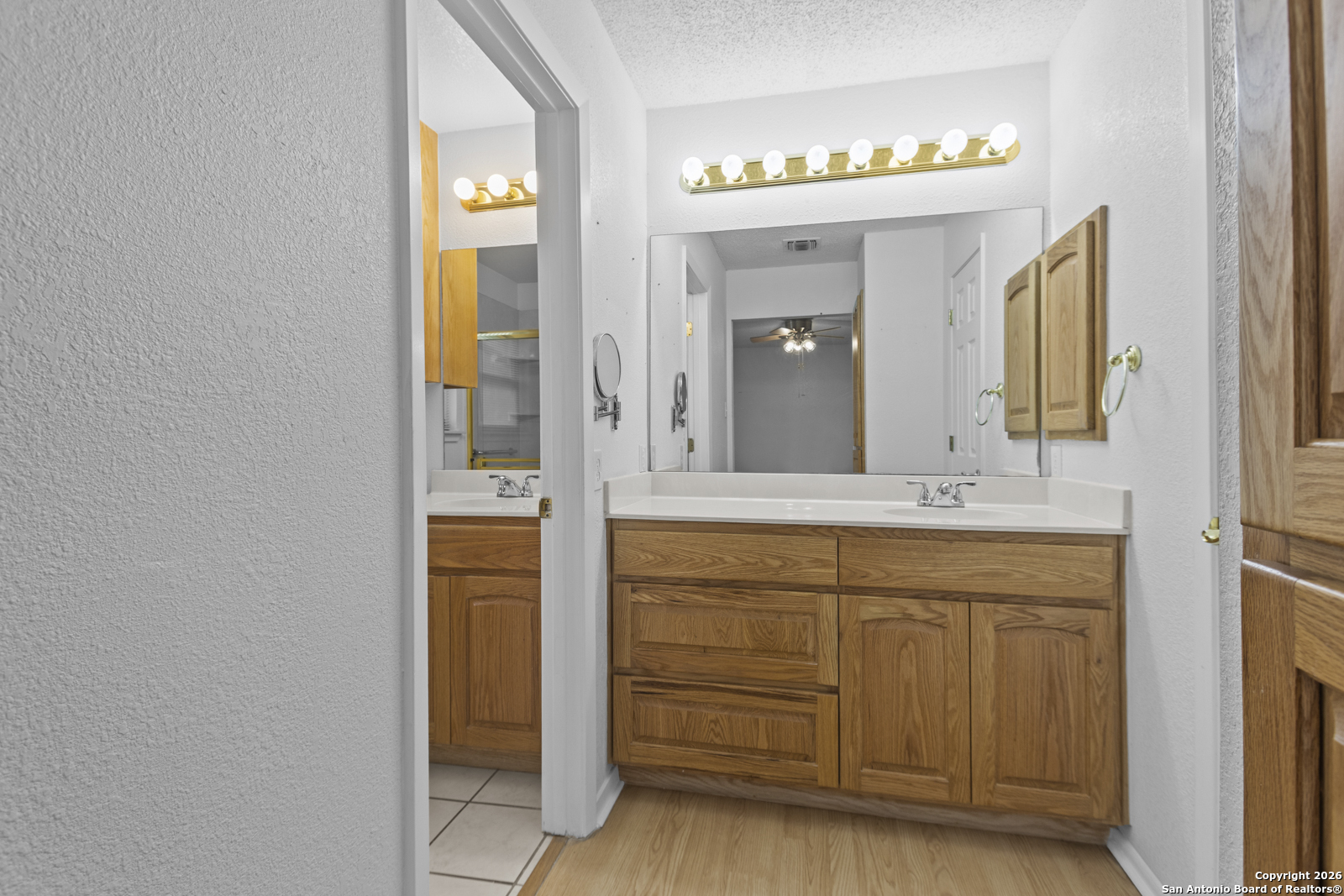 33171 Blanco Road Bulverde, TX 78163 - Photo 21 of 59 a bathroom with a sink and a mirror