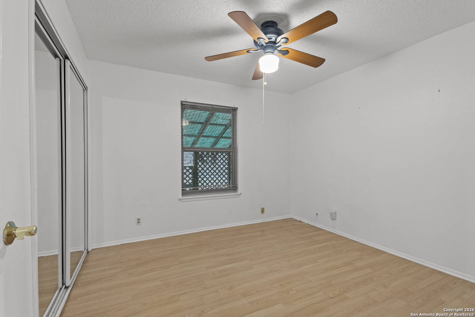 33171 Blanco Road Bulverde, TX 78163 - Photo 32 of 59 an empty room with a window