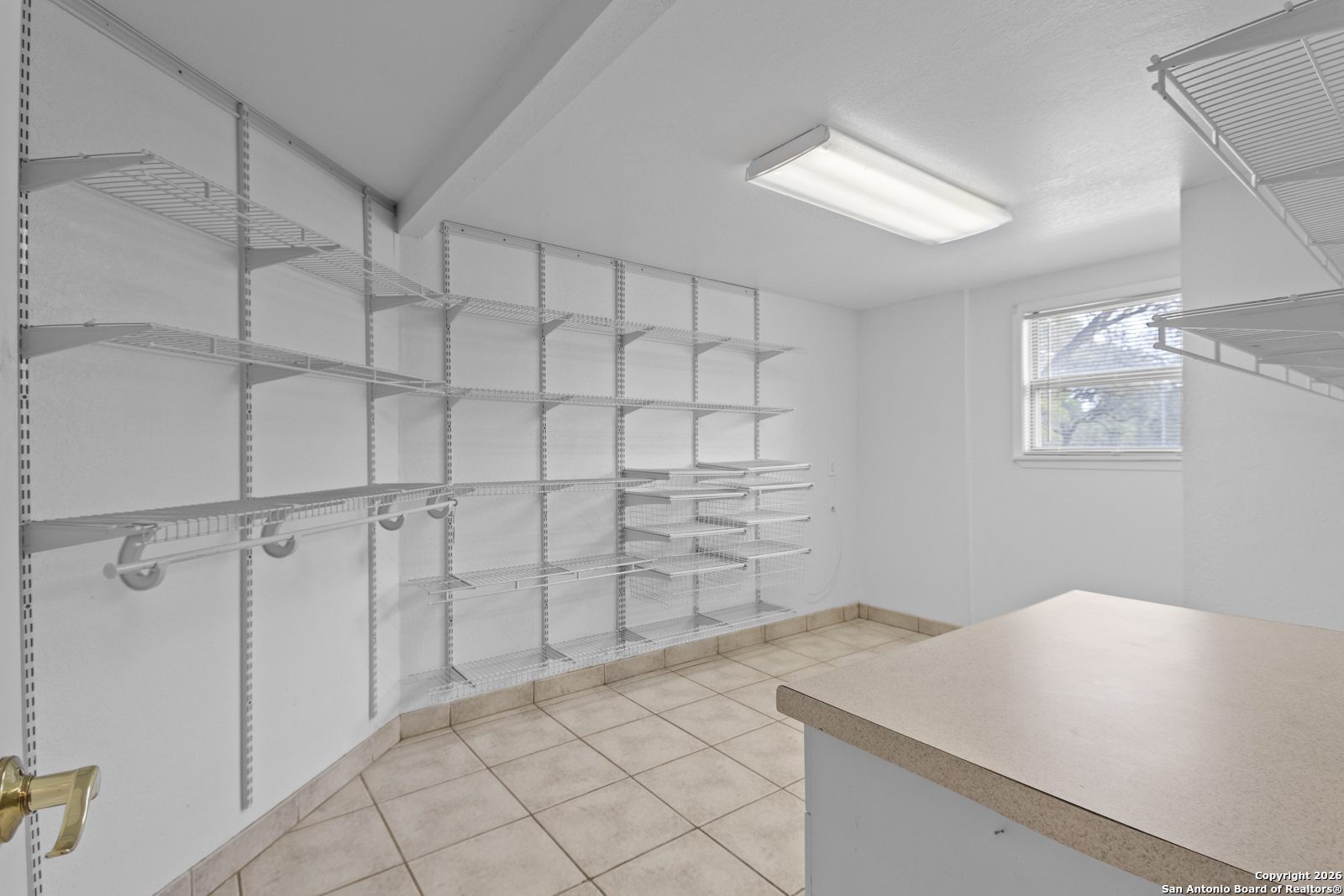 33171 Blanco Road Bulverde, TX 78163 - Photo 34 of 59 a view of a kitchen that has a sink and cabinets
