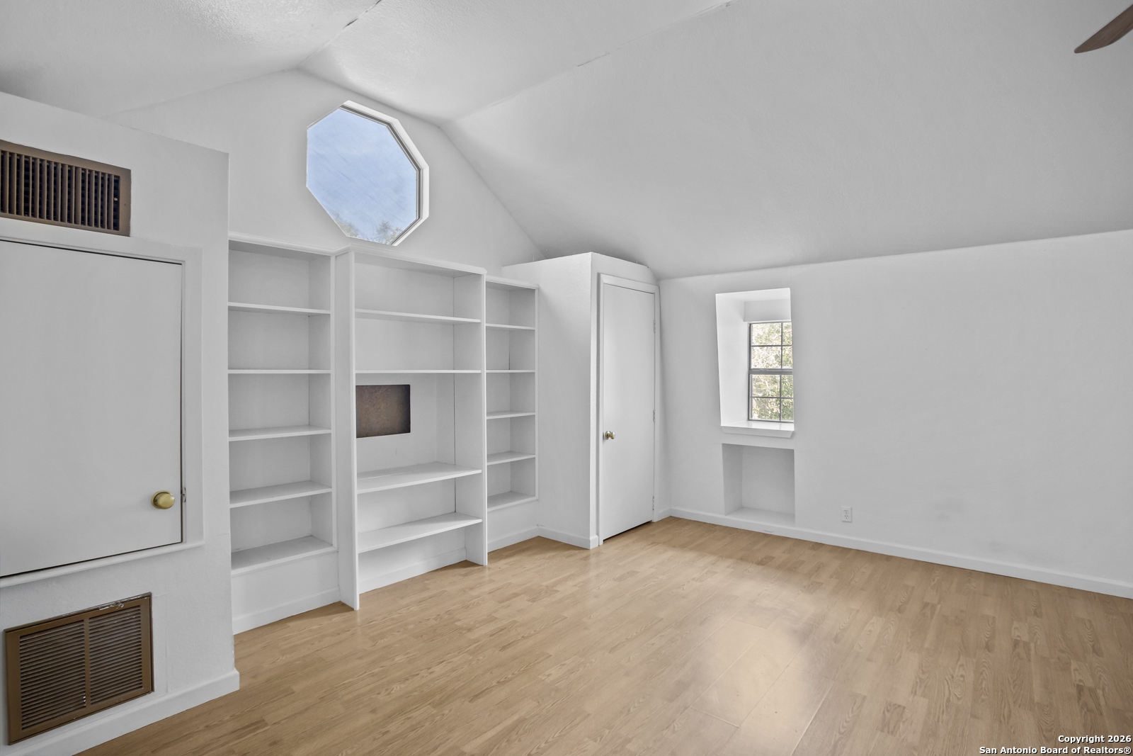 33171 Blanco Road Bulverde, TX 78163 - Photo 50 of 59 a view of an empty room with a window and wooden floor