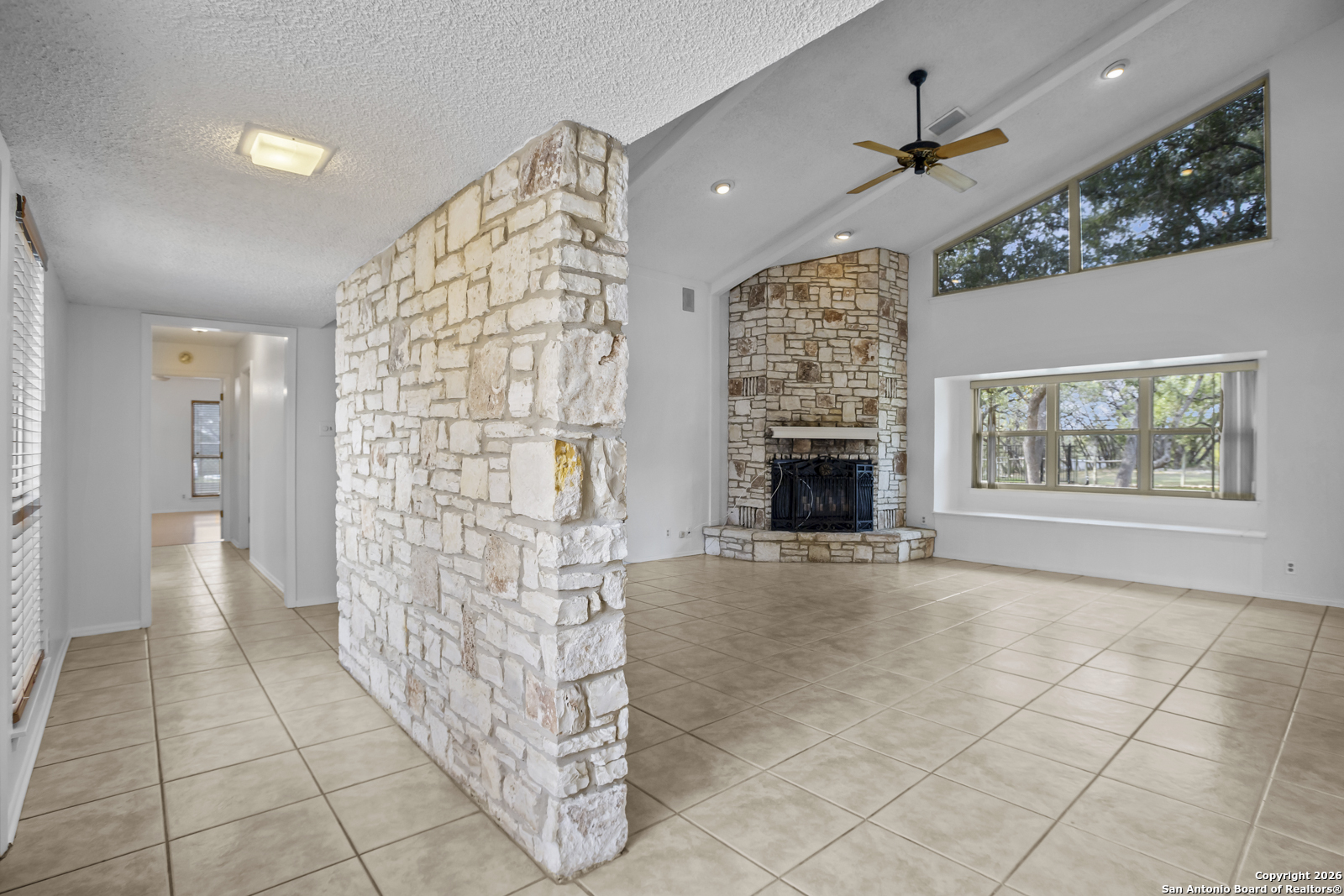 33171 Blanco Road Bulverde, TX 78163 - Photo 6 of 59 a view of livingroom with hardwood floor and a fireplace