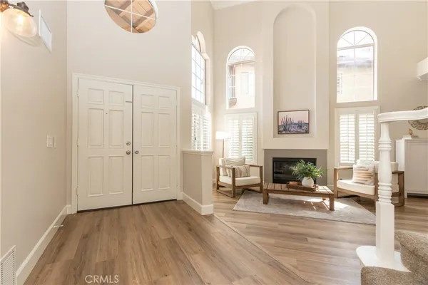 a living room with furniture and a fireplace
