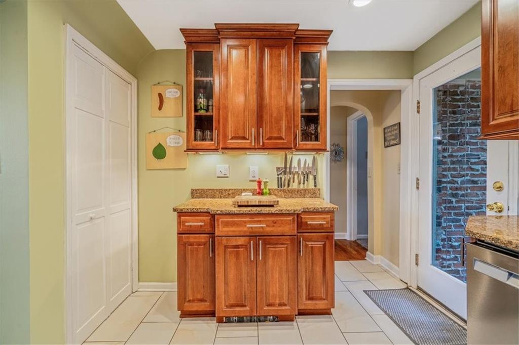 21 Marquette Road Pittsburgh, PA 15229 - Photo 14 of 44 a kitchen with stainless steel appliances a stove and a refrigerator