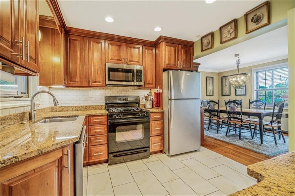 21 Marquette Road Pittsburgh, PA 15229 - Photo 15 of 44 a kitchen with stainless steel appliances granite countertop a refrigerator stove microwave and sink