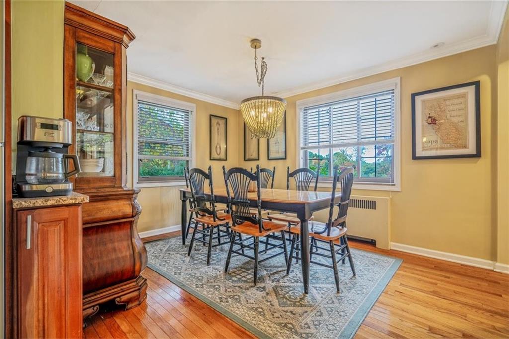 21 Marquette Road Pittsburgh, PA 15229 - Photo 16 of 44 a dining room with furniture a chandelier and wooden floor