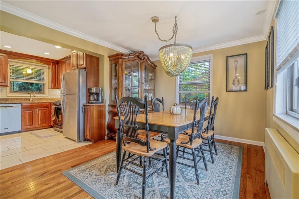 21 Marquette Road Pittsburgh, PA 15229 - Photo 18 of 44 a view of a dining room with furniture window and wooden floor