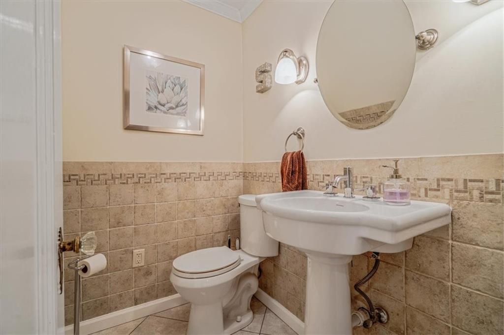 21 Marquette Road Pittsburgh, PA 15229 - Photo 19 of 44 a bathroom with a sink a toilet and a mirror
