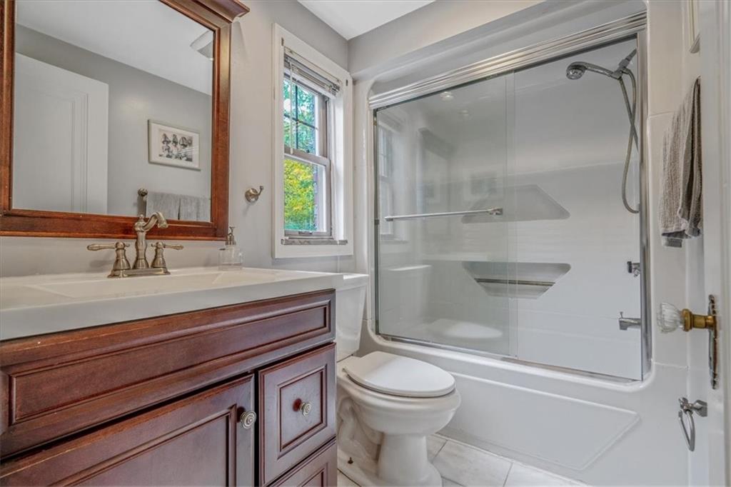 21 Marquette Road Pittsburgh, PA 15229 - Photo 29 of 44 a bathroom with a sink a toilet and shower