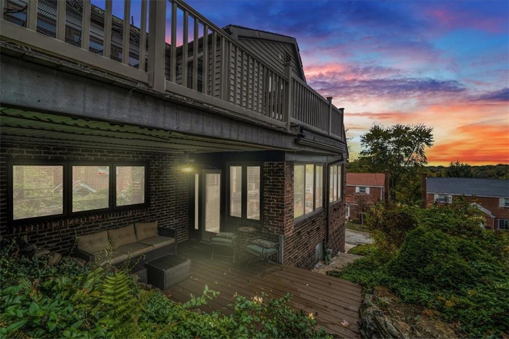 21 Marquette Road Pittsburgh, PA 15229 - Photo 33 of 44 a view of a house with large windows and flower plants